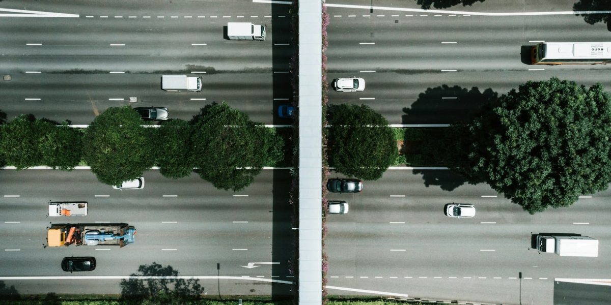 aerial photography of vehicle traveling on road during daytime